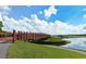 Picturesque footbridge spanning a lake, surrounded by lush greenery at 7728 Rio Bella Pl, Bradenton, FL 34201