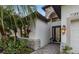 Front entrance with stone accents and a lantern light at 7728 Rio Bella Pl, Bradenton, FL 34201