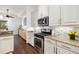 Modern kitchen with stainless steel appliances and granite countertops at 7728 Rio Bella Pl, Bradenton, FL 34201
