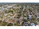 An aerial view of a neighborhood featuring well-maintained homes, tree-lined streets and a waterfront at 807 62Nd W St, Bradenton, FL 34209