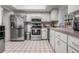 Functional kitchen with stainless steel appliances, white cabinetry and modern fixtures at 807 62Nd W St, Bradenton, FL 34209