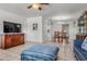 Spacious living room with tile floors, neutral walls, TV, and dining room view at 807 62Nd W St, Bradenton, FL 34209