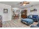 Inviting living room with tile floors, neutral walls, dining table, and comfortable seating at 807 62Nd W St, Bradenton, FL 34209