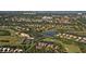Aerial view of community with golf course and homes at 8750 Olde Hickory Ave # 9205, Sarasota, FL 34238