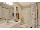 Clean bathroom with a shower/tub combo and nautical-themed decor at 8750 Olde Hickory Ave # 9205, Sarasota, FL 34238