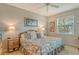 Primary bedroom with a king-size bed and coastal decor at 8750 Olde Hickory Ave # 9205, Sarasota, FL 34238