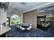 Private dining space with golf course view and table setting at 8750 Olde Hickory Ave # 9205, Sarasota, FL 34238