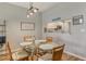 Dining area with glass-top table and kitchen pass-through at 8750 Olde Hickory Ave # 9205, Sarasota, FL 34238