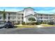 Two-story condo building with parking and landscaping at 8750 Olde Hickory Ave # 9205, Sarasota, FL 34238