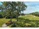 Spacious patio with a serene view of the golf course and pond at 8750 Olde Hickory Ave # 9205, Sarasota, FL 34238