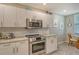 Modern kitchen with granite countertops and stainless steel appliances at 8750 Olde Hickory Ave # 9205, Sarasota, FL 34238
