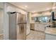 Modern kitchen with stainless steel appliances and granite countertops at 8750 Olde Hickory Ave # 9205, Sarasota, FL 34238