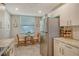 Eat-in kitchen with a small table and stainless steel appliances at 8750 Olde Hickory Ave # 9205, Sarasota, FL 34238