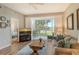 Living room with view of bedroom and access to balcony at 8750 Olde Hickory Ave # 9205, Sarasota, FL 34238