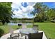 Enjoy outdoor dining on the patio overlooking the pond at 8750 Olde Hickory Ave # 9205, Sarasota, FL 34238