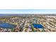 Wide aerial view of a residential neighborhood with various houses and lakes at 8818 29Th E St, Parrish, FL 34219