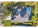 Top-down view of a house, pool, and landscaped yard at 8818 29Th E St, Parrish, FL 34219