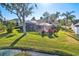 House with a screened pool and lush green backyard at 8818 29Th E St, Parrish, FL 34219