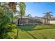 Landscaped backyard with pool and grassy area at 8818 29Th E St, Parrish, FL 34219