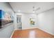 Bedroom with wood flooring, ceiling fan, and access to bathroom at 8818 29Th E St, Parrish, FL 34219