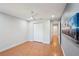 Bedroom with wood flooring, ceiling fan and access to hallway at 8818 29Th E St, Parrish, FL 34219
