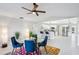 Dining area with glass table and colorful rug, open to the kitchen at 8818 29Th E St, Parrish, FL 34219