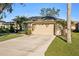 Home features a long driveway and attached garage at 8818 29Th E St, Parrish, FL 34219