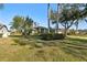 Landscaped yard with mature trees surrounds the home at 8818 29Th E St, Parrish, FL 34219