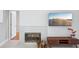 Modern fireplace with wood storage and large TV at 8818 29Th E St, Parrish, FL 34219