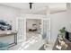 Home office with French doors opening to living room at 8818 29Th E St, Parrish, FL 34219