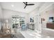 Home office with built-in desk and view to the entryway at 8818 29Th E St, Parrish, FL 34219