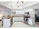 Modern kitchen with stainless steel appliances and white cabinets at 8818 29Th E St, Parrish, FL 34219