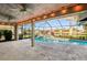 Covered lanai with pool and lake view at 8818 29Th E St, Parrish, FL 34219