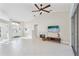 Open living room with tile floors and view to the entryway at 8818 29Th E St, Parrish, FL 34219
