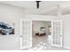 Open living room with fireplace and pool view at 8818 29Th E St, Parrish, FL 34219