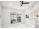Bright home office features large window, wood-look tile floors, and French doors at 8818 29Th E St, Parrish, FL 34219