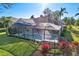 Spacious screened pool with surrounding landscaping at 8818 29Th E St, Parrish, FL 34219