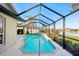 Inviting screened pool with lake view at 8818 29Th E St, Parrish, FL 34219