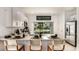Modern kitchen with white cabinets, quartz countertops, and stainless steel appliances at 8958 Daybreak St, Sarasota, FL 34241