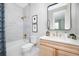 Clean bathroom with modern vanity, bathtub, and gold fixtures at 9985 Key Haven Rd, Seminole, FL 33777