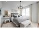 Serene bedroom with upholstered bed and plenty of natural light at 9985 Key Haven Rd, Seminole, FL 33777