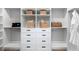 Large walk-in closet with ample shelving and drawers at 9985 Key Haven Rd, Seminole, FL 33777