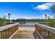 Wooden dock with water access, offering scenic views and relaxing atmosphere at 9985 Key Haven Rd, Seminole, FL 33777