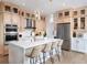 Modern kitchen with light wood cabinets, large island, and stainless steel appliances at 9985 Key Haven Rd, Seminole, FL 33777