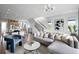 Spacious living room with L-shaped sectional sofa and hardwood floors at 9985 Key Haven Rd, Seminole, FL 33777
