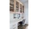 Home office with built-in shelves and desk at 9985 Key Haven Rd, Seminole, FL 33777