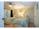 Guest bedroom with twin beds and shared bathroom access at 1001 Benjamin Franklin Dr # 110, Sarasota, FL 34236