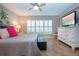 Relaxing bedroom, featuring a ceiling fan and ample natural light at 1001 Benjamin Franklin Dr # 110, Sarasota, FL 34236