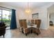 Dining area with wicker chairs and glass table at 1001 Benjamin Franklin Dr # 110, Sarasota, FL 34236