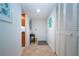 Bright entryway with tile flooring and built-in storage at 1001 Benjamin Franklin Dr # 110, Sarasota, FL 34236